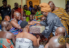 Kojo Antwi presents his new book to Otumfuo and Asantehemaa